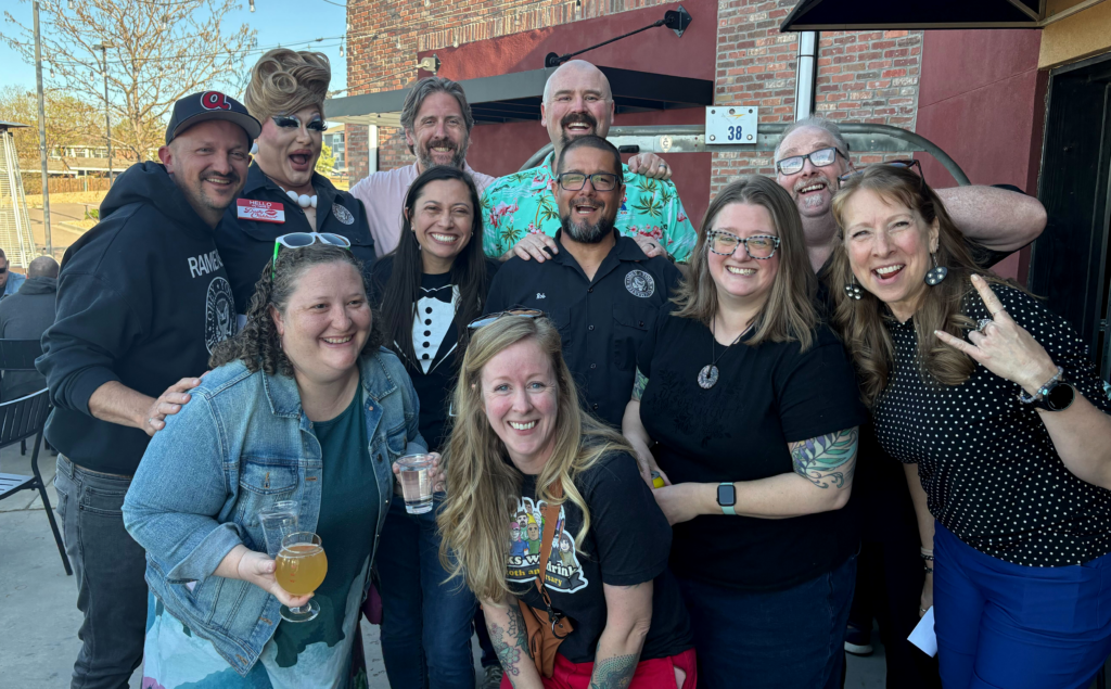 A group photo of Geeks Who Drink hosts and quizmasters.